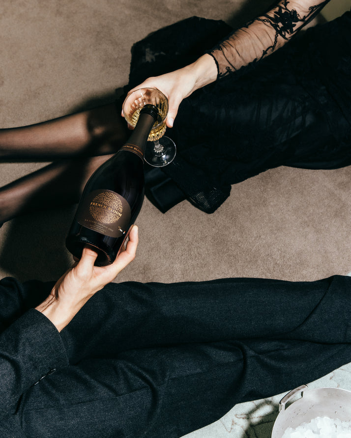 French Bloom La Cuvée Vintage 2023 bottle being served during an elegant celebration.