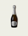 French Bloom L’Extra Brut 0.0% alcohol bottle on a minimalist off-white background.