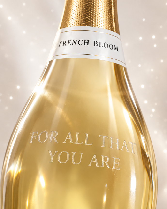 Close-up of a French Bloom bottle personalized with the engraving ‘For All That You Are