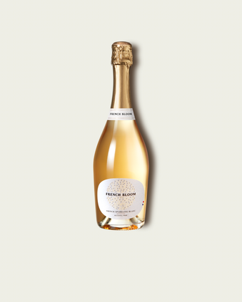 French Bloom Le Blanc 0.0% alcohol bottle on a minimalist off-white background.