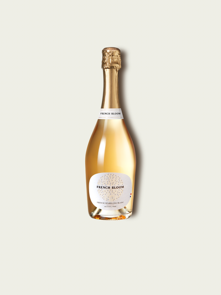 French Bloom Le Blanc 0.0% alcohol bottle on a minimalist off-white background.