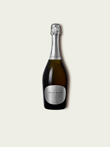 French Bloom L’Extra Brut 0.0% alcohol bottle on a minimalist off-white background.