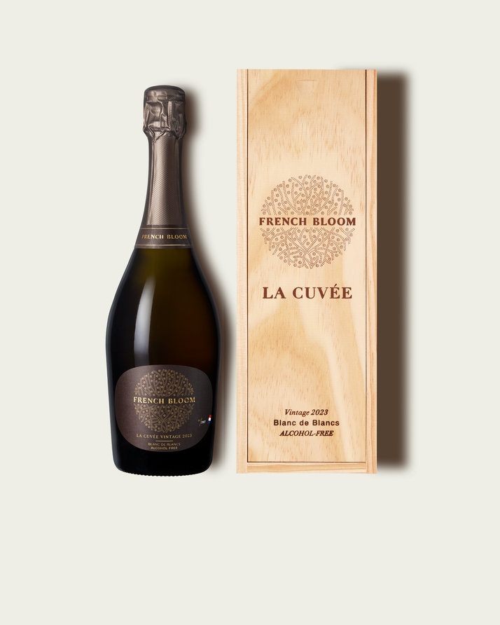 French Bloom La Cuvée Vintage 2023 bottle presented alongside its signature wooden gift box.