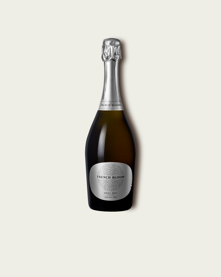 French Bloom L’Extra Brut 0.0% alcohol bottle on a minimalist off-white background.