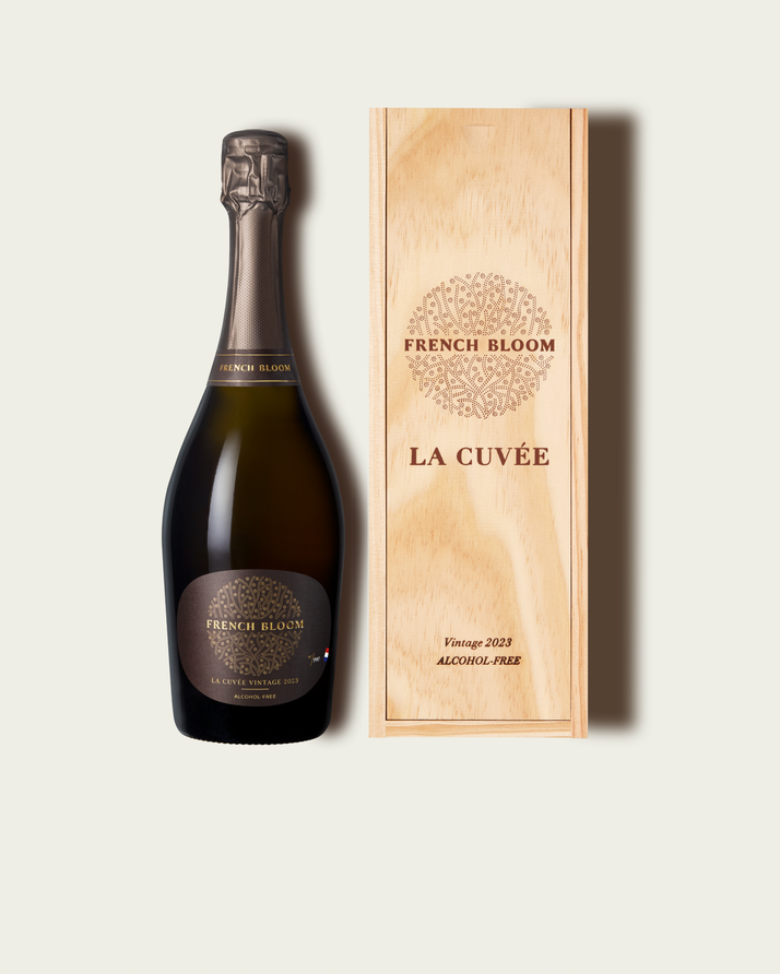 French Bloom La Cuvée Vintage 2023 bottle presented alongside its signature wooden gift box.