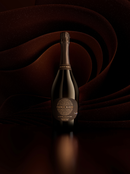 French Bloom La Cuvée Vintage 2023 bottle set against a deep brown sculptural background.