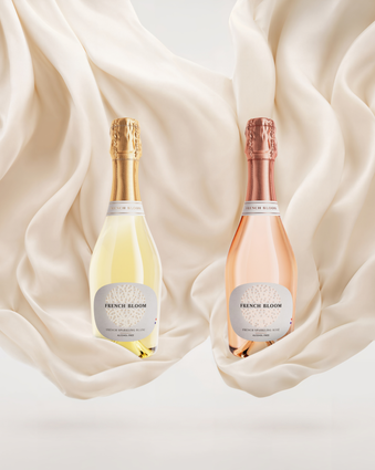 French Bloom Le Blanc and Le Rosé half bottles set against flowing ivory fabric.