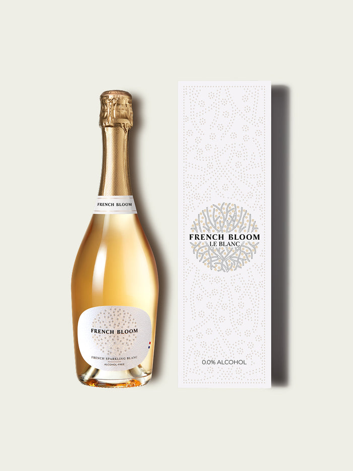 Bottle of French Bloom sparkling wine and gift box on a white background