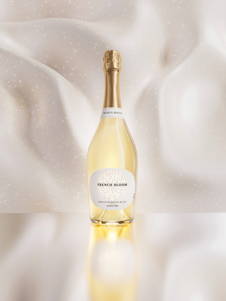 French Bloom Le Blanc bottle against an elegant luminous ivory background.