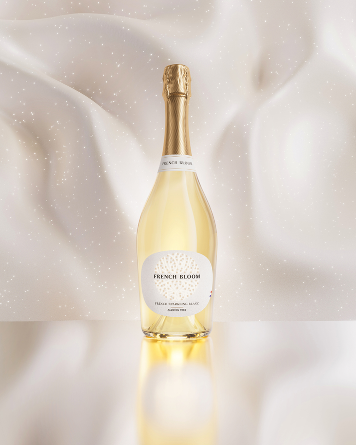 French Bloom Le Blanc bottle against an elegant luminous ivory background.
