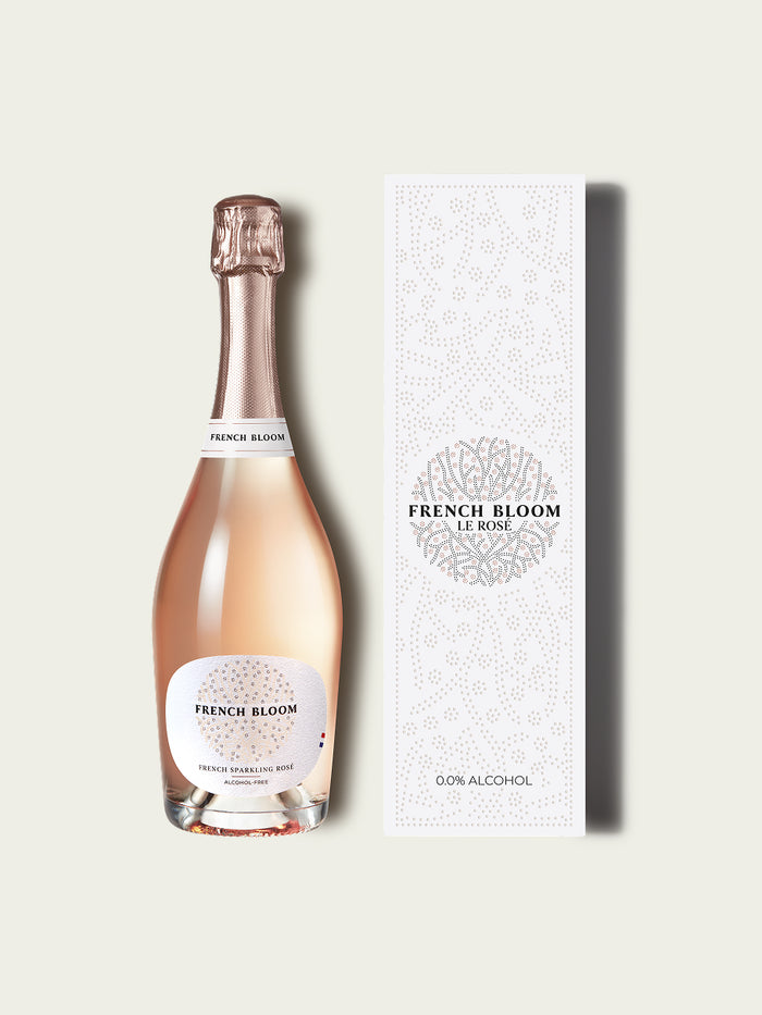 Bottle of French Bloom sparkling wine and giftbox on a white background